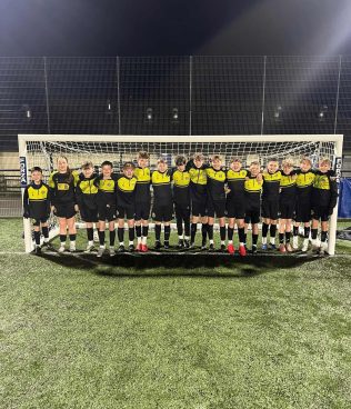 A line of young footballers from Strathaven Dynamo's