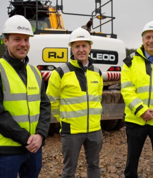 OnPath Energy senior project manager Alan Wells, RJ McLeod contracts manager Lorcan Hayes and OnPath Energy construction director Martin Kellerman at the Mill Rig Wind Farm site